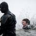A Ford Lake Frozen Leap participant jumps into the cold water on Saturday, Feb. 16. Daniel Brenner I AnnArbor.com